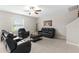 Inviting living room with cozy black leather furniture and lots of natural light at 2175 Old Mining Rd, Lakeland, FL 33801