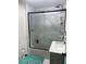 Bathroom featuring a walk-in shower, bathtub, showerhead, shelves, toilet, sink and faucet at 225 N Palmetto Ave, Fort Meade, FL 33841