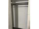 An interior shot of an empty closet with a clothes rod and shelf for storage at 225 N Palmetto Ave, Fort Meade, FL 33841