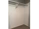 Functional closet space with a rod for hanging clothes and storage at 225 N Palmetto Ave, Fort Meade, FL 33841