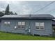 Side view of home with solar panels on the roof at 225 N Palmetto Ave, Fort Meade, FL 33841