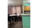 Open layout kitchen and dining area with table and chairs at 225 N Palmetto Ave, Fort Meade, FL 33841