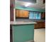 Eat-in kitchen showcasing stainless appliances, cabinetry, and bar with counter seating at 225 N Palmetto Ave, Fort Meade, FL 33841