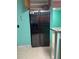 Kitchen showcasing stainless steel fridge and stone counters at 225 N Palmetto Ave, Fort Meade, FL 33841