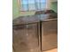 Modern washer and dryer set in a well-lit laundry area at 225 N Palmetto Ave, Fort Meade, FL 33841