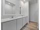 Beautiful bathroom featuring double sinks, stylish cabinets, and modern finishes at 247 Big Sioux Dr, Poinciana, FL 34759