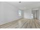 Spacious room with neutral wall colors, ample natural light, and attractive wood-look flooring at 247 Big Sioux Dr, Poinciana, FL 34759