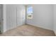 Inviting bedroom with neutral carpet, a window, and ample space for furnishings at 247 Big Sioux Dr, Poinciana, FL 34759