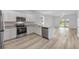 Modern kitchen with stainless steel appliances, granite countertops, and an open layout with natural light at 247 Big Sioux Dr, Poinciana, FL 34759