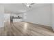 Bright, open layout with wood-look flooring connects the living area to the kitchen and dining spaces at 247 Big Sioux Dr, Poinciana, FL 34759