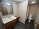 This bathroom features a sink, toilet, and walk-in shower at 2777 Cr 673, Bushnell, FL 33513