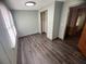 This bedroom features hard surface floors, closet, and neutral paint at 2777 Cr 673, Bushnell, FL 33513