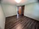 This bedroom features hard surface floors and closet at 2777 Cr 673, Bushnell, FL 33513
