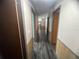 The hallway features hard surface floors and neutral paint at 2777 Cr 673, Bushnell, FL 33513