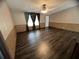 Spacious living room featuring dark wood floors, neutral-toned walls and a ceiling fan at 2777 Cr 673, Bushnell, FL 33513