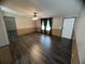 Spacious living room with dark vinyl floors and a ceiling fan at 2777 Cr 673, Bushnell, FL 33513