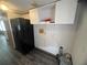 Small utility room with black refrigerator and washer/dryer hookups at 2777 Cr 673, Bushnell, FL 33513