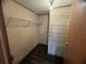Walk-in closet with wood-look floors and lots of wire shelving for optimal storage at 2777 Cr 673, Bushnell, FL 33513