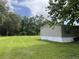 Spacious grassy yard surrounding a cozy single-story home, offering a peaceful and serene setting at 2777 Cr 673, Bushnell, FL 33513