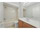 Bathroom with a tub and shower combo, and a light wood vanity at 5233 Los Palma Vista Dr, Orlando, FL 32837