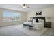 Bright main bedroom featuring a large window, modern furnishings, and neutral decor at 5233 Los Palma Vista Dr, Orlando, FL 32837