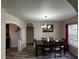 Inviting dining room featuring wood floors, stylish light fixture and plenty of space for Gathering gatherings at 701 N 7Th St, Haines City, FL 33844