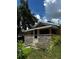 Charming home featuring a stone facade, well-manicured greenery, and a cozy, inviting entrance at 701 N 7Th St, Haines City, FL 33844