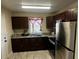 Well-lit kitchen with stainless steel appliances, granite countertops, and ample cabinet space at 701 N 7Th St, Haines City, FL 33844