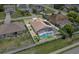 Aerial view of the screened in pool and fenced backyard of this single Gathering home at 1955 Manatee Ct, Kissimmee, FL 34759