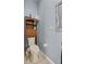 Compact bathroom with a toilet, cabinet, and mirror, designed for functionality and convenience in a small space at 1955 Manatee Ct, Kissimmee, FL 34759