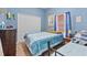 Cozy bedroom featuring blue walls, carpet, closet, one window and queen sized beds at 1955 Manatee Ct, Kissimmee, FL 34759