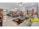 Open concept living room and kitchen with tile flooring, recessed lighting, and modern decor at 1955 Manatee Ct, Kissimmee, FL 34759