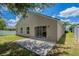 Backyard featuring a patio and lush green lawn, perfect for outdoor entertaining and relaxation at 316 Red Kite Dr, Groveland, FL 34736