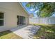 The backyard featuring patio, lush green grass and privacy fence at 316 Red Kite Dr, Groveland, FL 34736