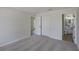 Neutral bedroom with carpet, closet and doorway to an ensuite bathroom at 316 Red Kite Dr, Groveland, FL 34736