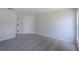 The neutral bedroom offers carpeted floors and a closet, perfect for a comfortable retreat at 316 Red Kite Dr, Groveland, FL 34736