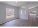 Bright and airy room with views of the backyard and wood-look flooring at 316 Red Kite Dr, Groveland, FL 34736