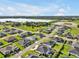 Aerial view of the property with the neighborhood with a beautiful lake in the distance at 3544 Lakeside Heritage Dr, Lakeland, FL 33812