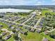 Aerial view of community showcasing the home's location near a lake and green spaces at 3544 Lakeside Heritage Dr, Lakeland, FL 33812