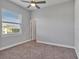 Bedroom featuring neutral walls, carpet floors, and a window allowing natural light at 3544 Lakeside Heritage Dr, Lakeland, FL 33812