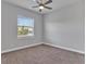 Bedroom featuring neutral walls, carpet floors, and a window allowing natural light at 3544 Lakeside Heritage Dr, Lakeland, FL 33812