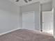 Bedroom featuring neutral walls, carpet floors, and a closet at 3544 Lakeside Heritage Dr, Lakeland, FL 33812