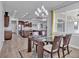 Open floor plan boasts dining area with a modern table and views of the kitchen and living room at 3544 Lakeside Heritage Dr, Lakeland, FL 33812