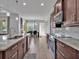 Gourmet kitchen features stainless steel appliances, a spacious island and sleek countertops at 3544 Lakeside Heritage Dr, Lakeland, FL 33812