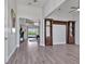 Open-concept living room features elegant floors, natural light, and built-in shelving at 3544 Lakeside Heritage Dr, Lakeland, FL 33812