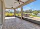 Relaxing screened patio featuring brick flooring and views of the lush backyard at 3544 Lakeside Heritage Dr, Lakeland, FL 33812