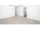 Bright bedroom featuring neutral carpet, with two doorways at 3808 Corsican Pl, Lake Alfred, FL 33850