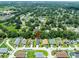 Expansive aerial view showcases a neighborhood with mature trees, lush landscaping, and serene ponds at 4132 Festival Pointe Blvd, Mulberry, FL 33860
