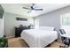 Cozy bedroom featuring a ceiling fan and a window offering natural light at 4132 Festival Pointe Blvd, Mulberry, FL 33860