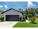Charming single-story home with a well-maintained lawn, a two-car garage, and fresh, neutral paint at 4132 Festival Pointe Blvd, Mulberry, FL 33860